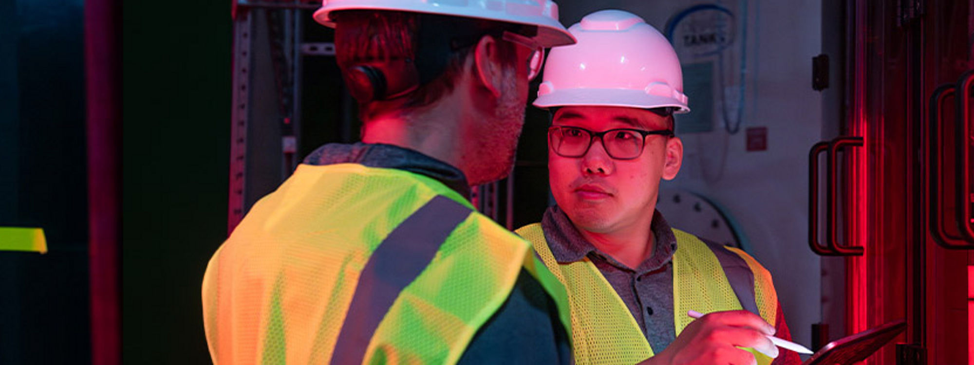 two men in facility with the red light