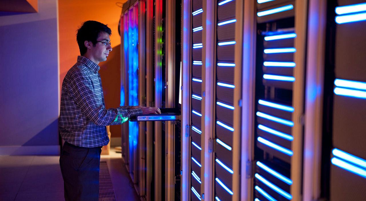 A technician working in a server room