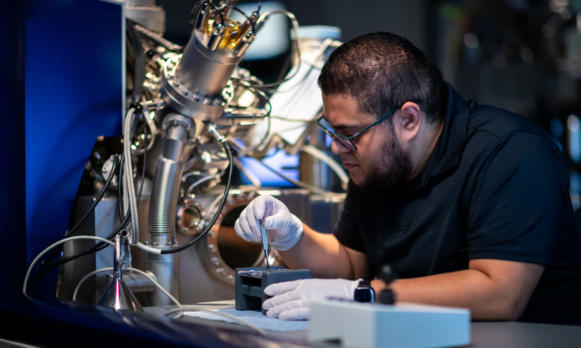 Man in a surface analysis lab