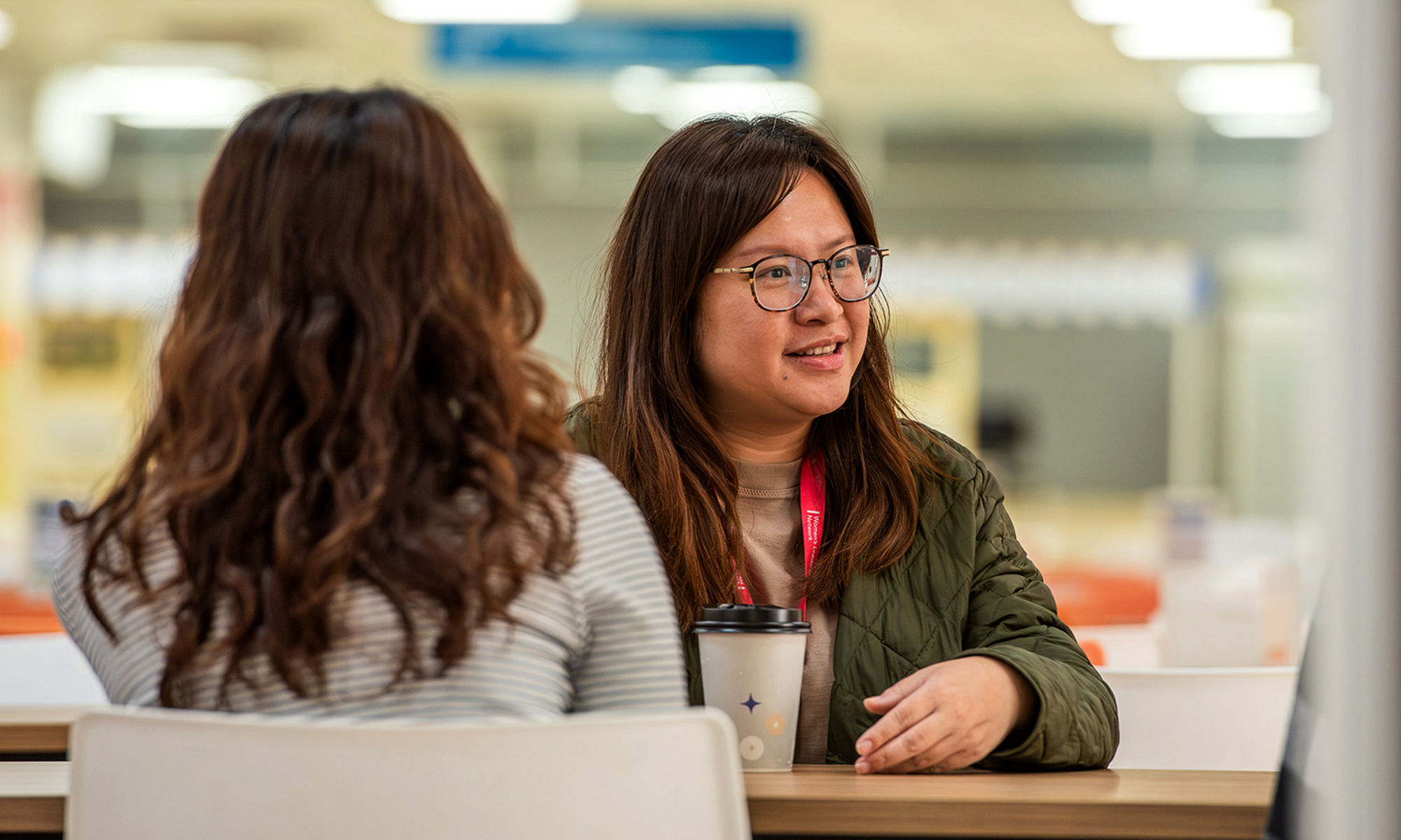 Young adults collaborating in a library