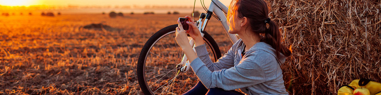 woman next to a bicycle in a farm