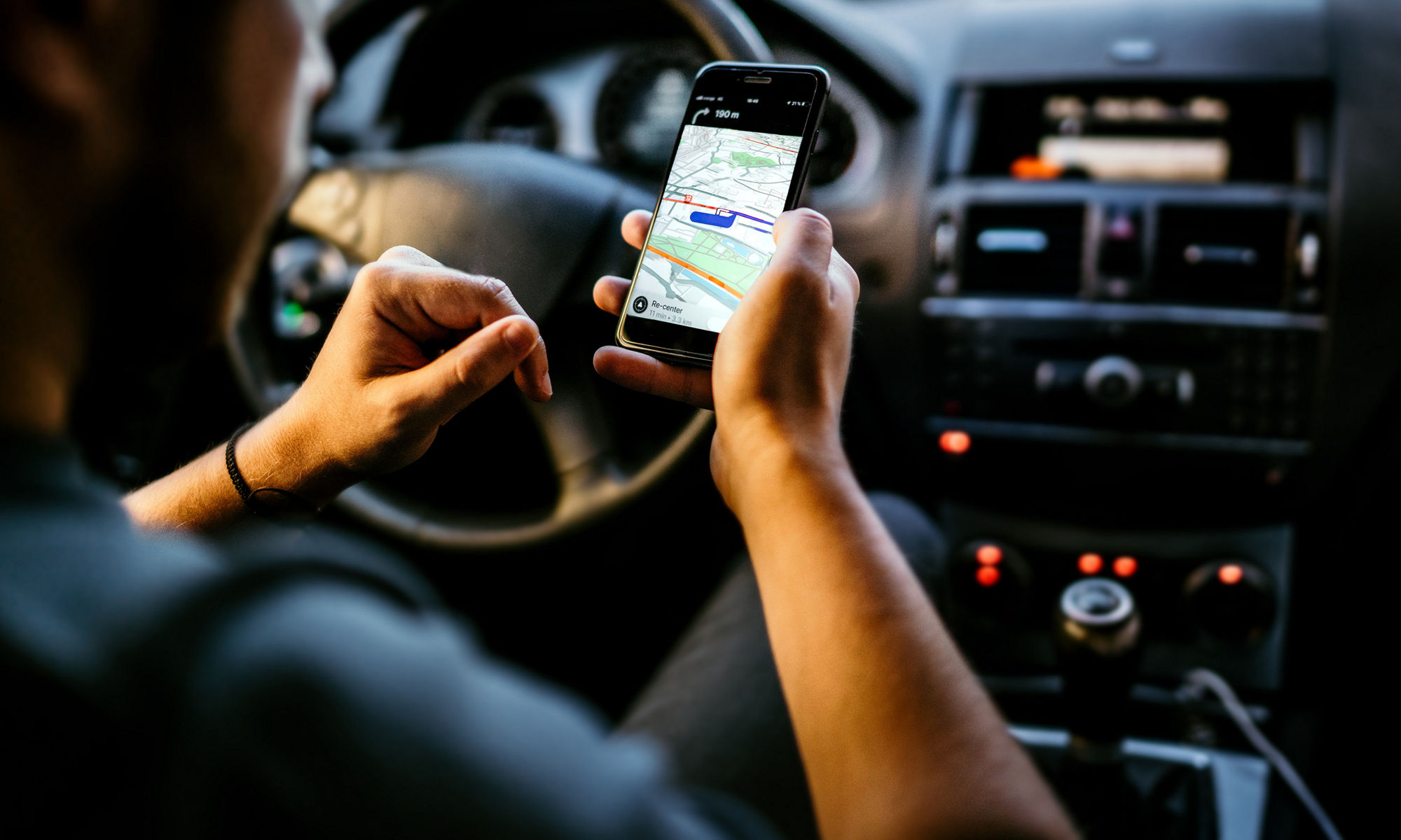 Driver using GPS on his phone