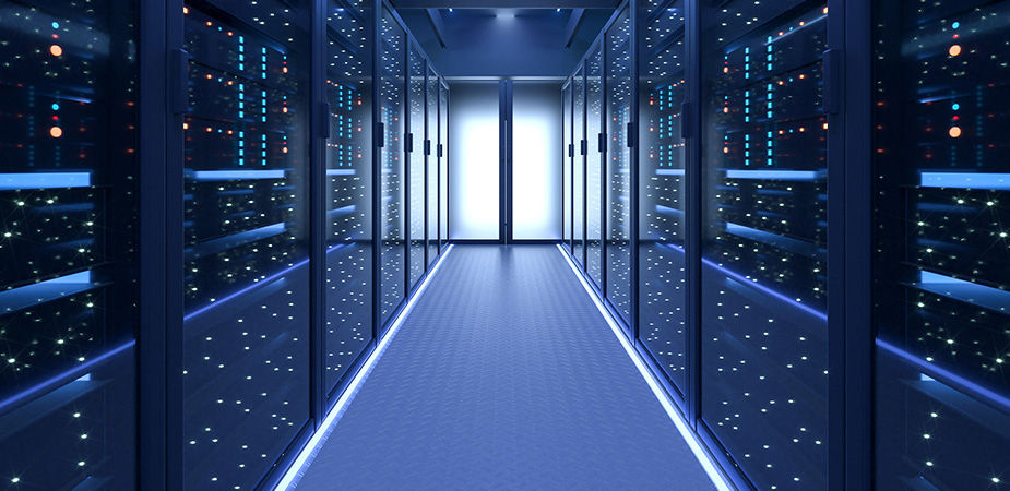 Long banks of data center storage on both side of a glowing door.