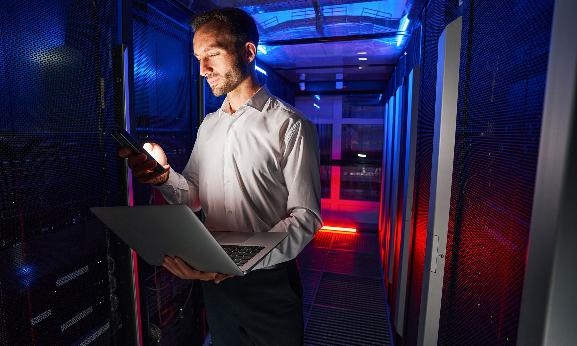 System admin standing in data center