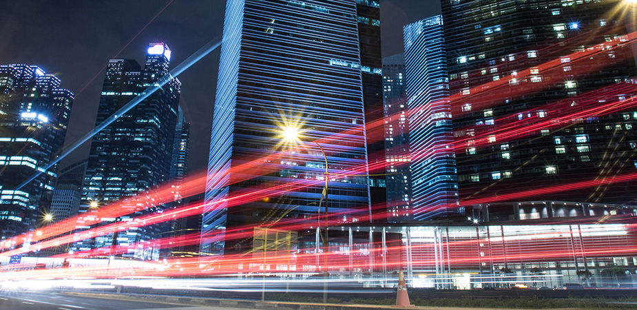 View looking up at Singapore skyscrapers at night