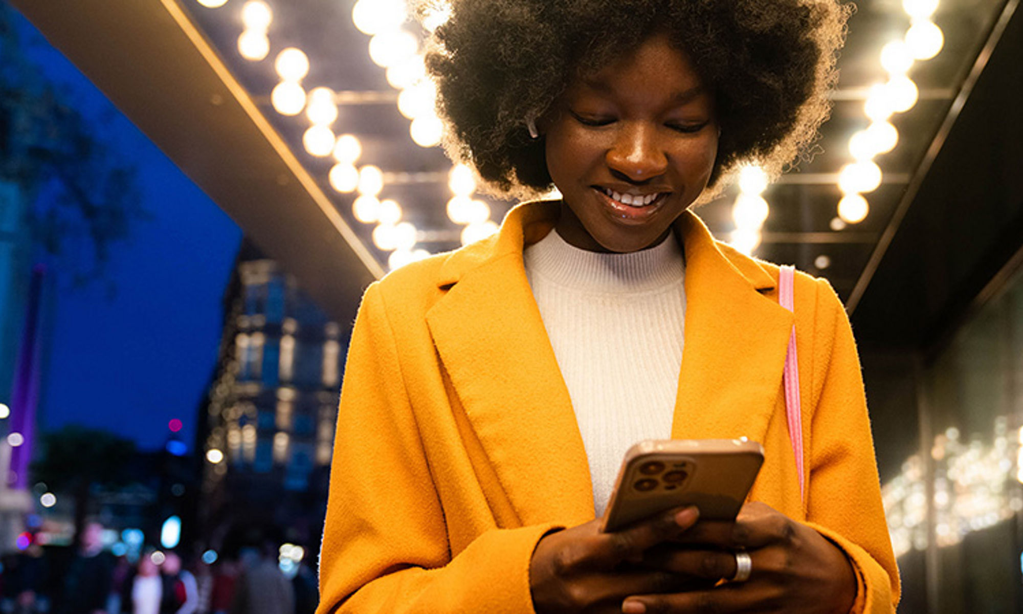 women looks delighted using the cell phone