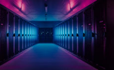 Wide-Angle Panorama Shot of a Working Data Center With Rows of Rack Servers. Red Emergency Led Lights Blinking and Computers are Working. Dark Ambient Light.