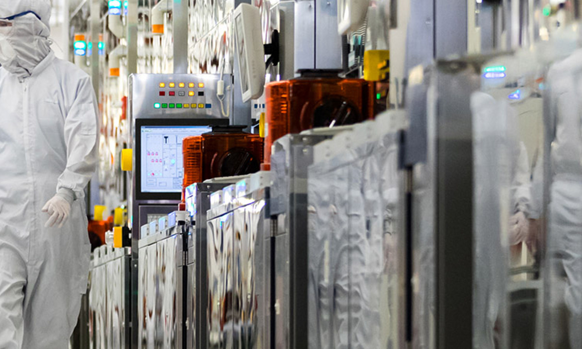 workers walking in a micron lab