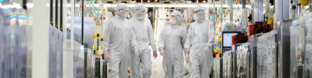 workers walking in a micron lab