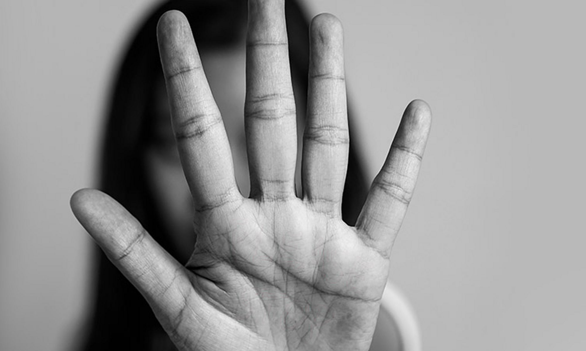 woman with a stop hand sign