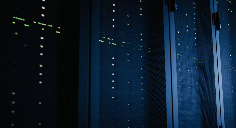 A man working in the data center room