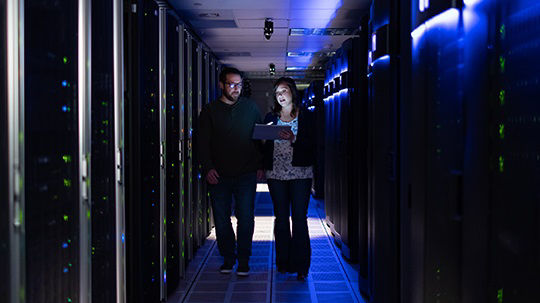 employees walking in a data center