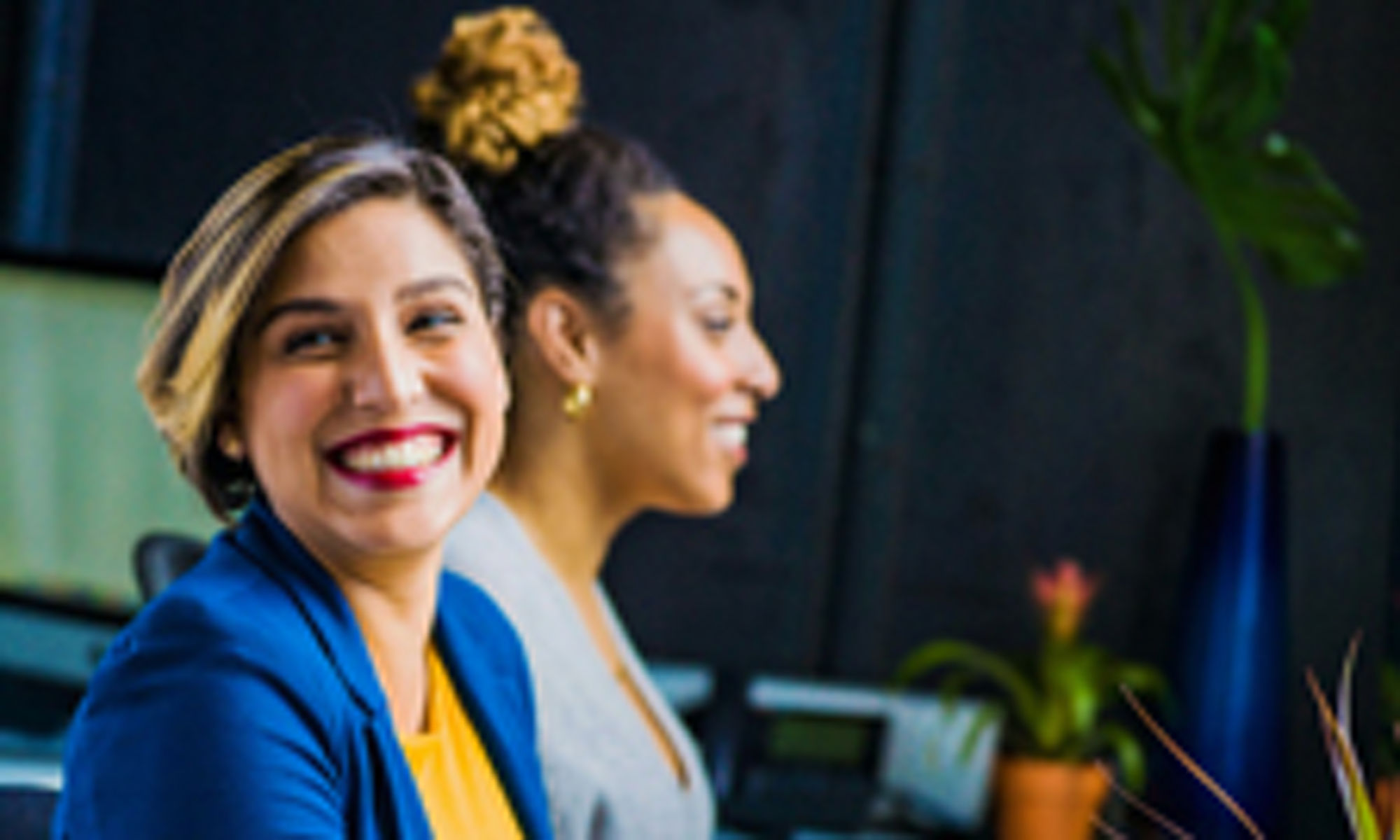 image of 2 women working