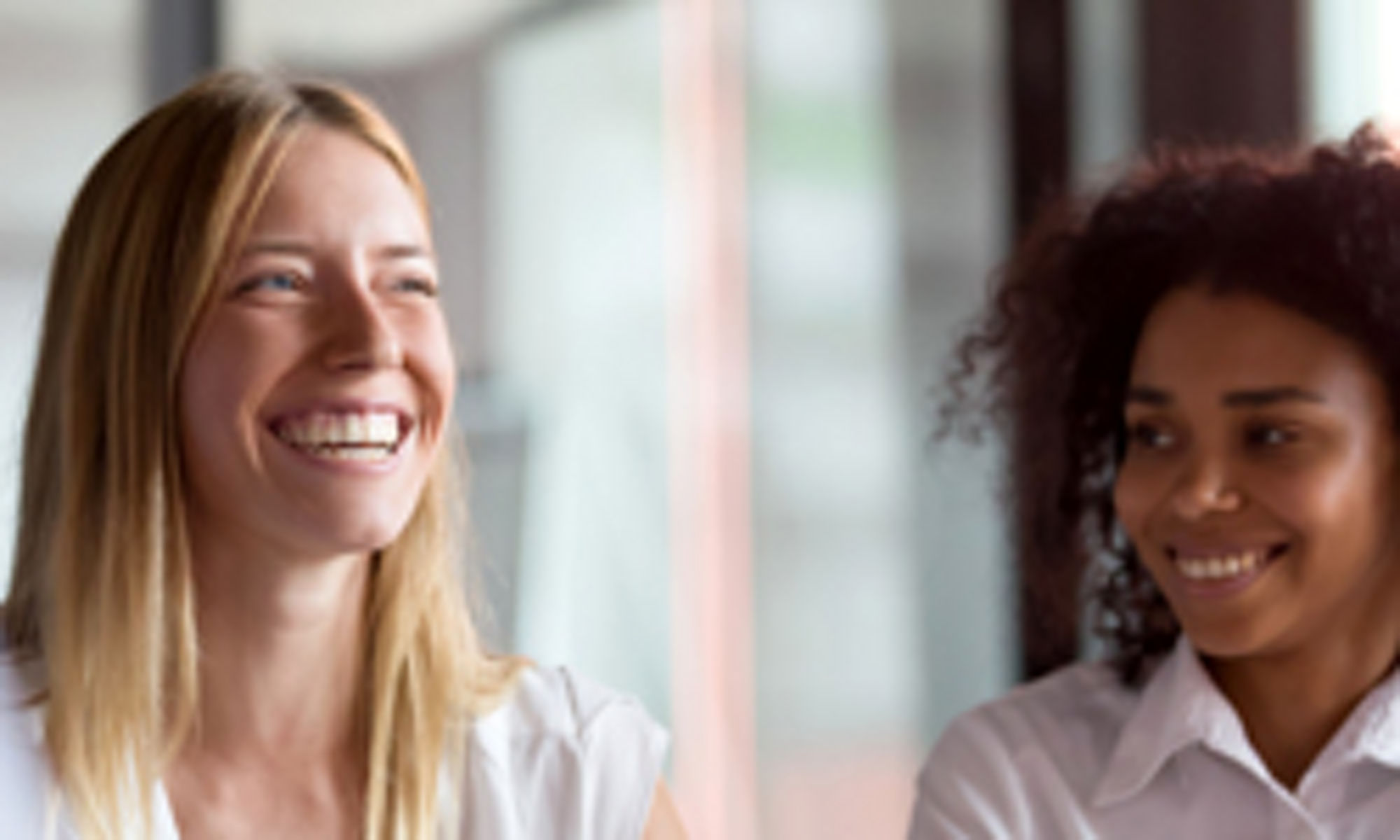 Two women smiling