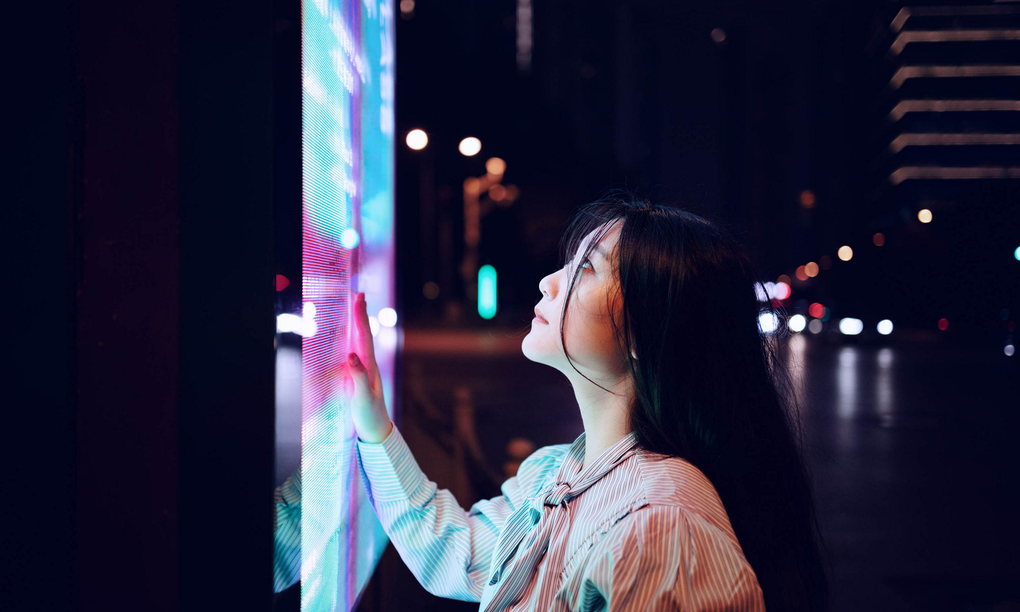 lady reading through a large display monitor