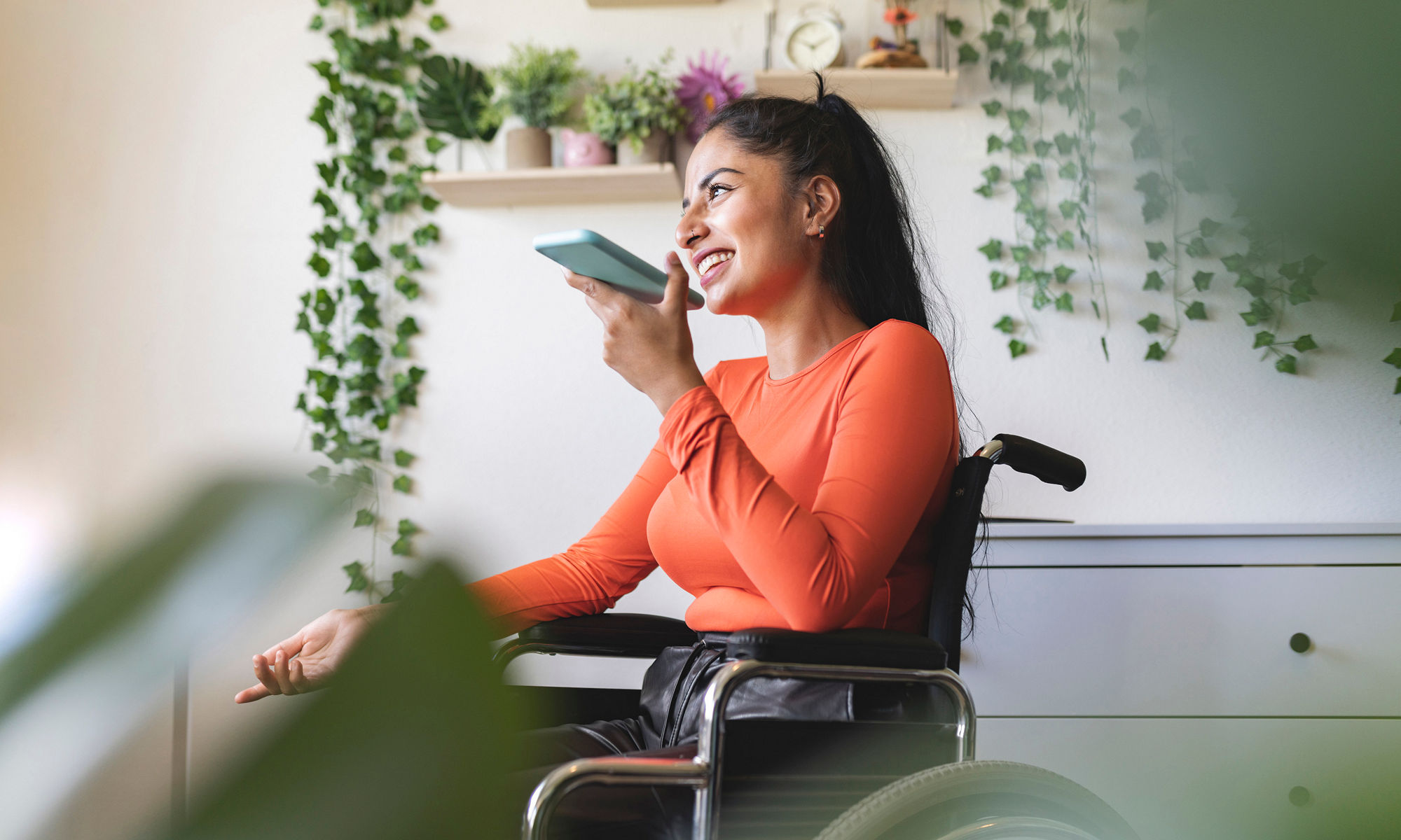 Women on wheelchair talking on the cell phone