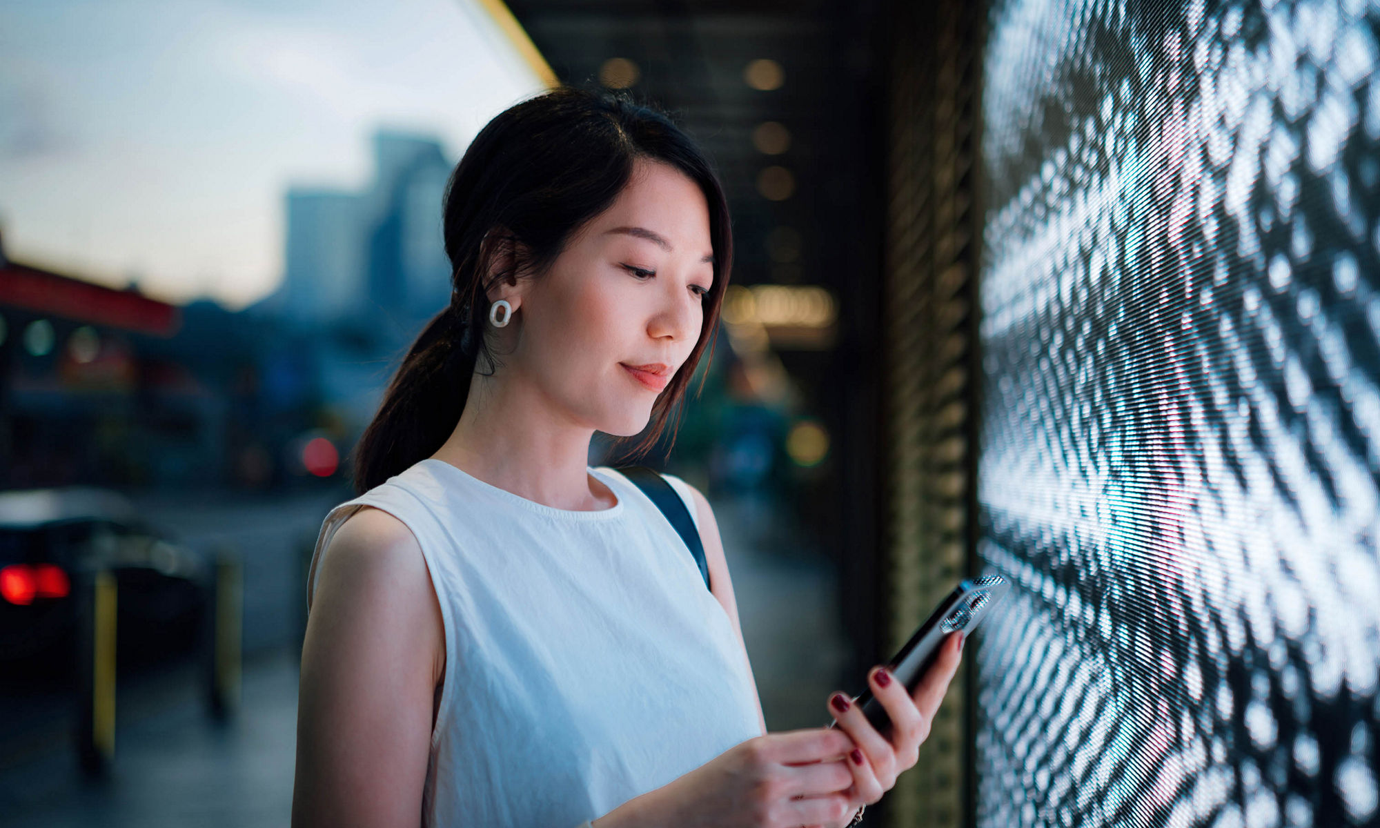 Woman holding mobile phone