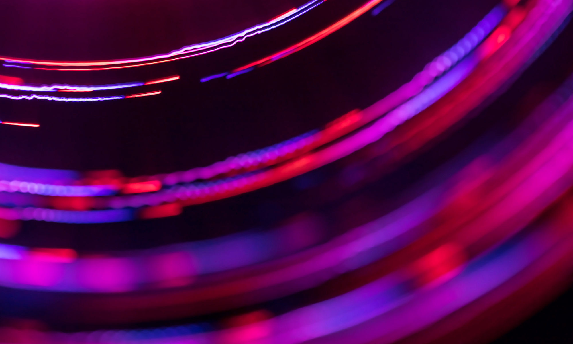 Abstract spinning multi colored lines with blurred motion effect and bokeh. Can be used as some technology (science, information, data, etc.) background.