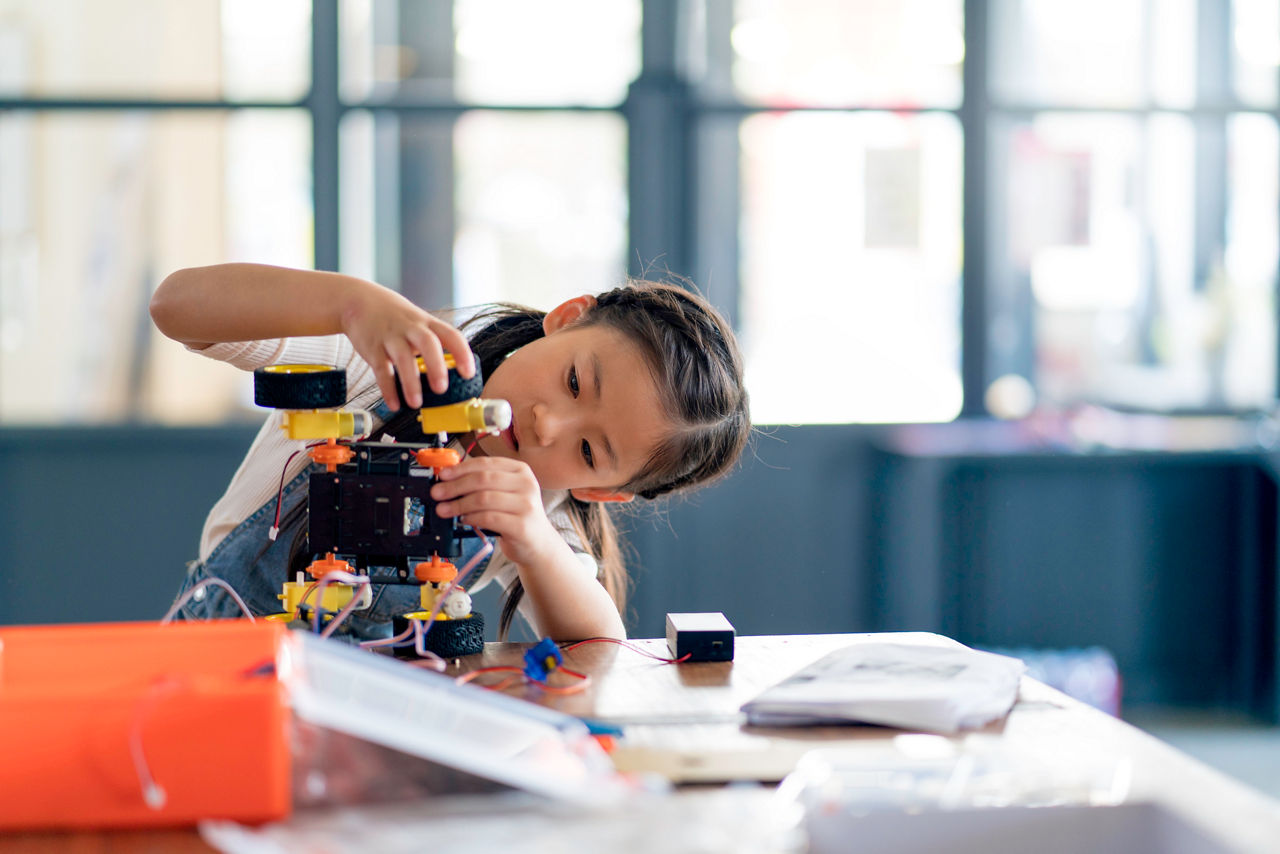 Young girl working on a robot design. Okayama, Japan