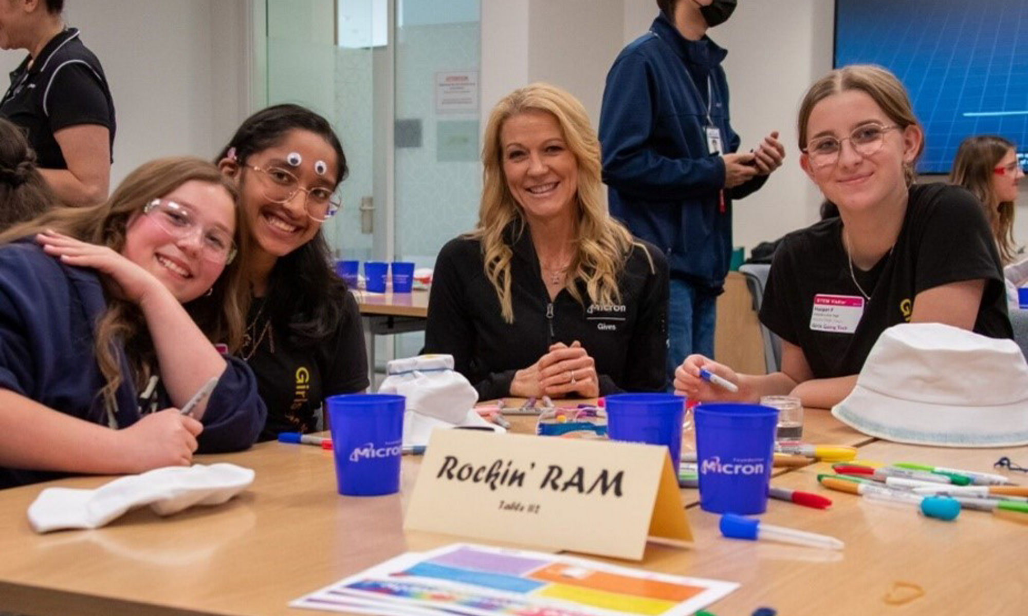 April Arzen sitting with girls at Girls Going Tech