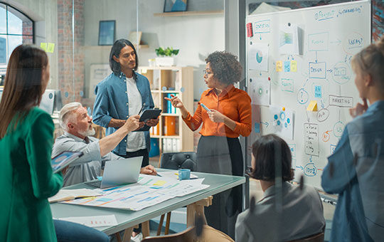 Micron team brainstorming at a whiteboard