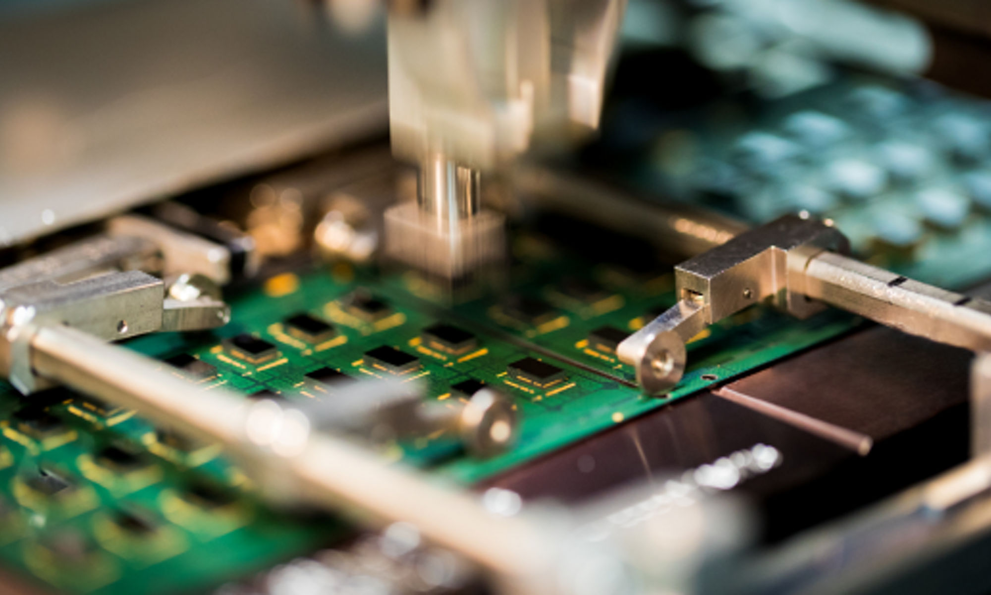 close up image of memory chips being installed on a module