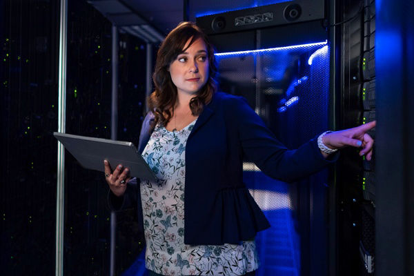 Woman standing in data center