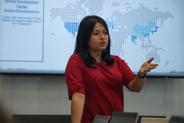 Woman giving a lecture in front of presentation