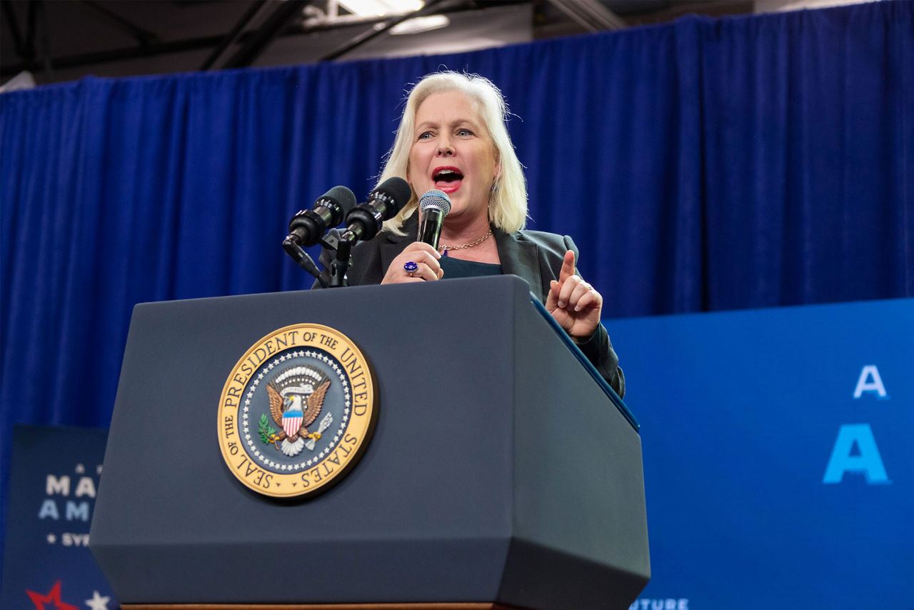 A women on stage addressing the audience