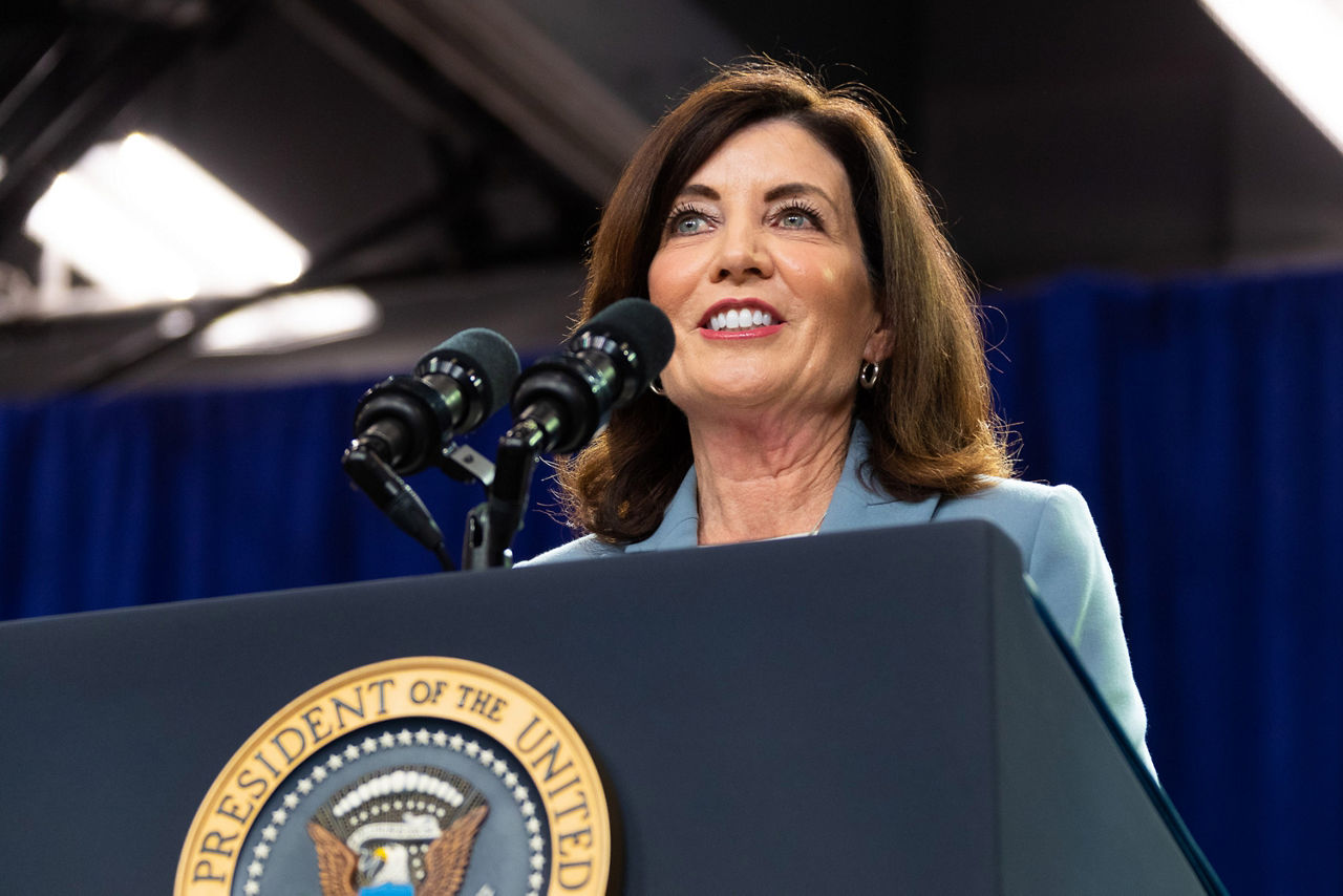 A women on stage addressing the audience