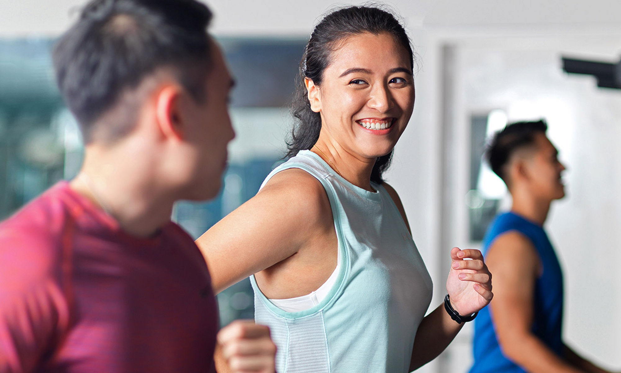 woman running on treadmill