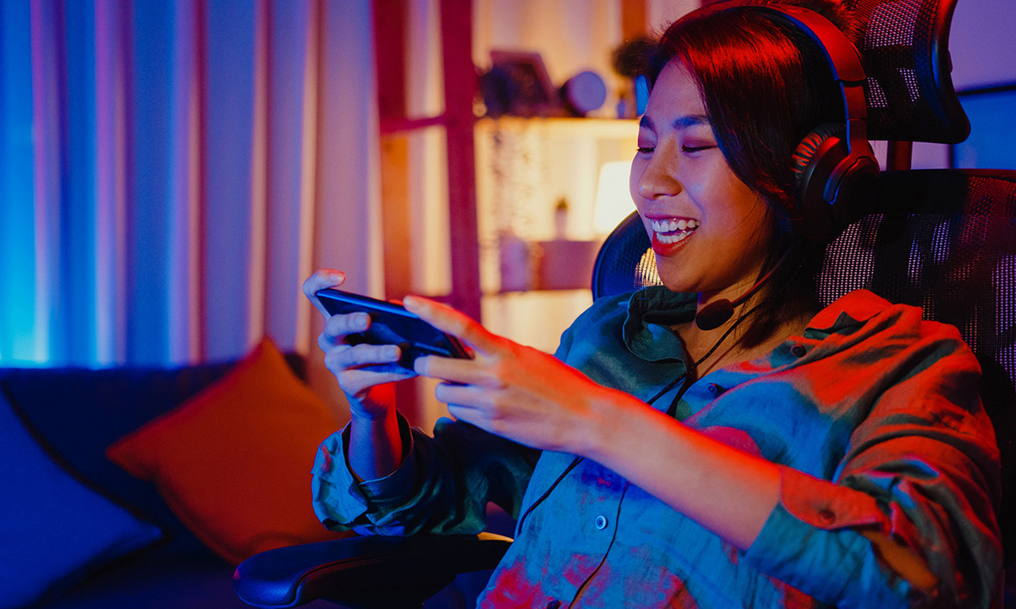 A girl gaming on her cellphone