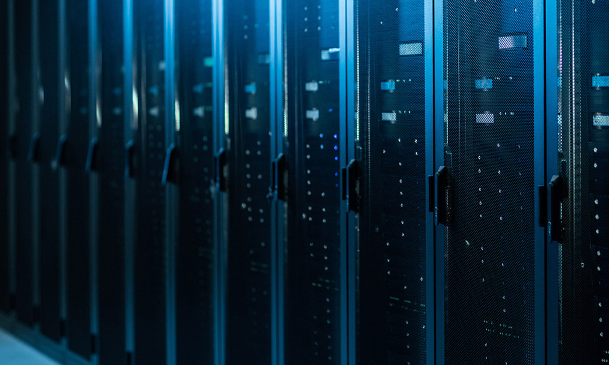 Rows of servers in a data center, in blue light