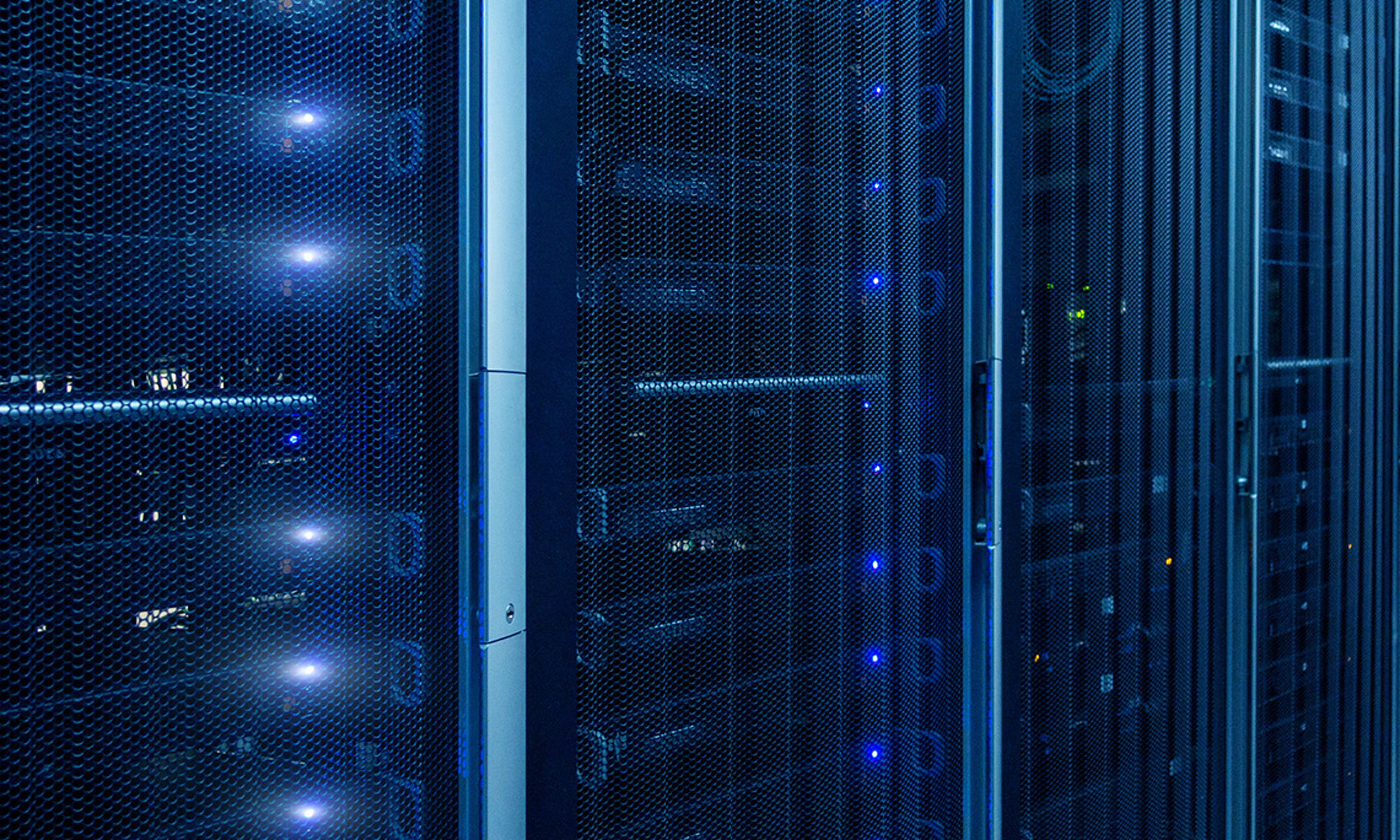 Zoomed in view of server racks in deep blue hues