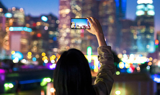 woman taking a photo on smartphone