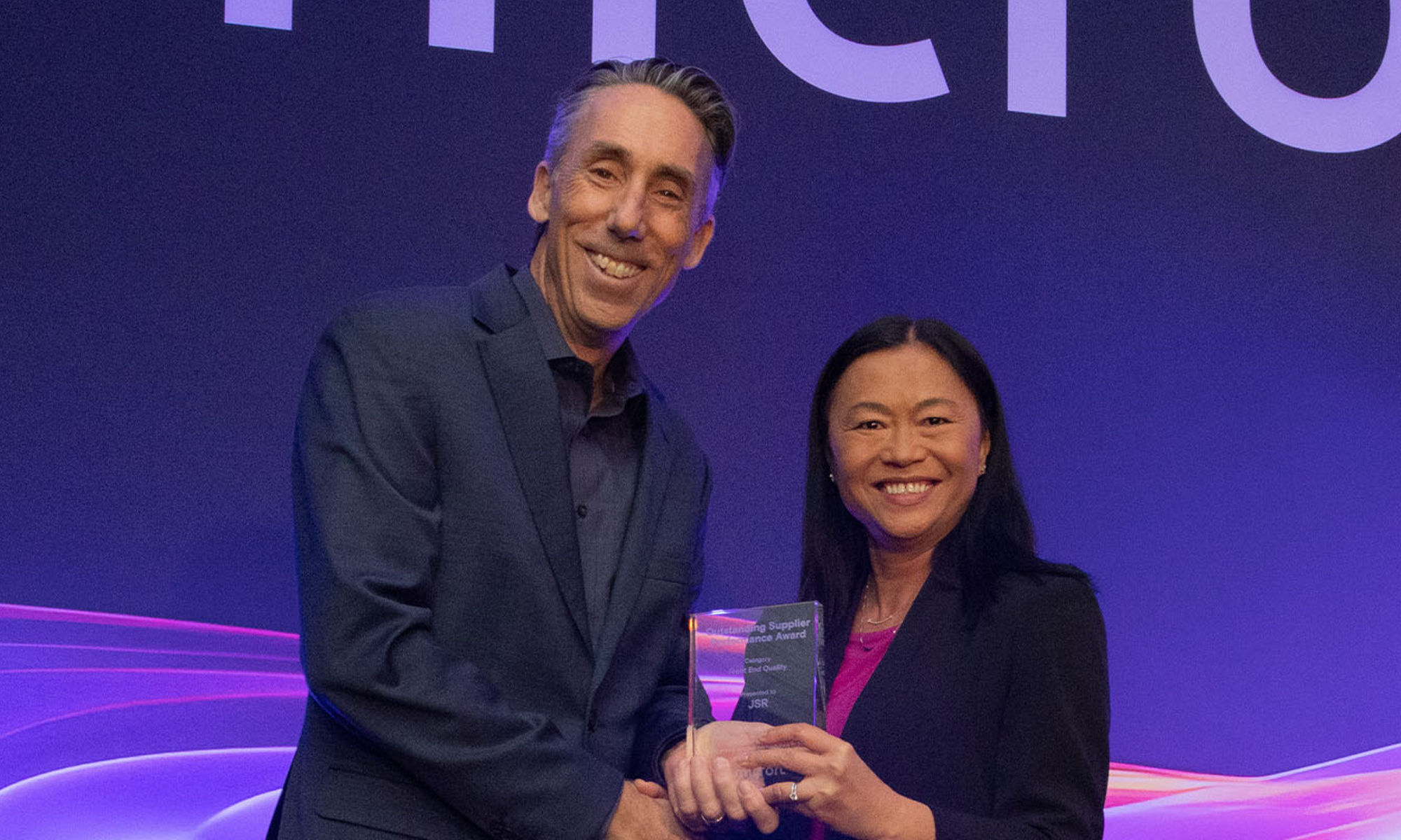 Thy Tran presenting the award to Mark Slezak