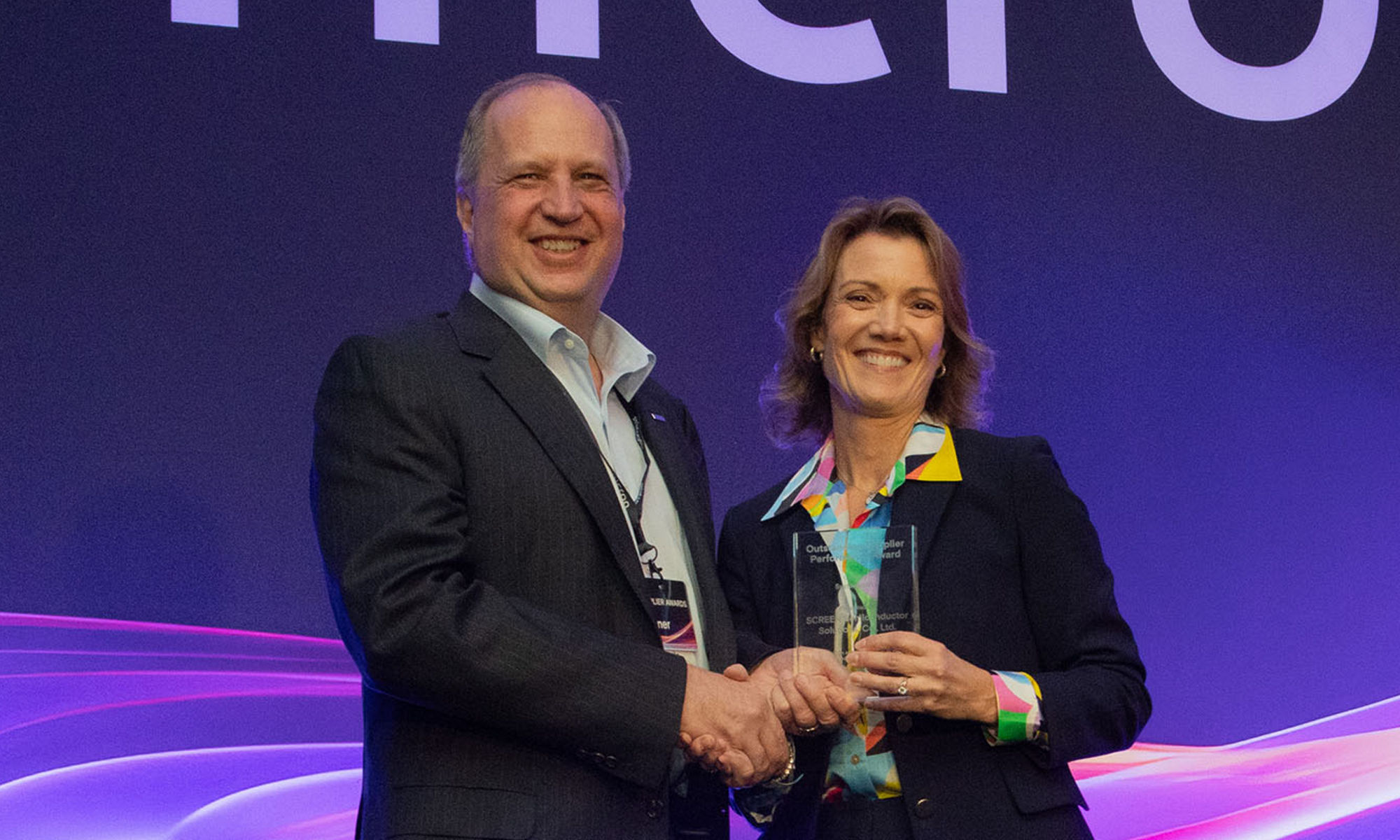 Elizabeth Elroy presenting the award to Laszlo Mikulas