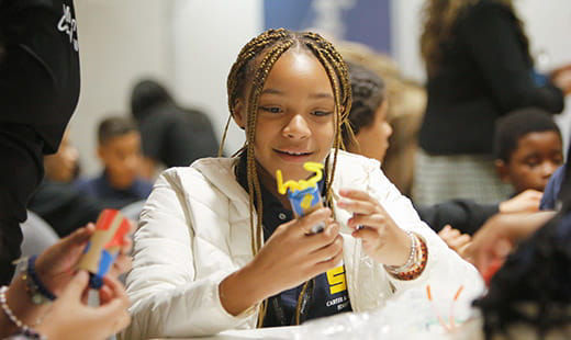 A young person engaging in a STEM activity