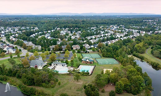View of the city with lots of house and greenery from a height
