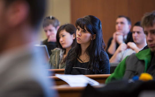 Student woman sitting listening to a talk