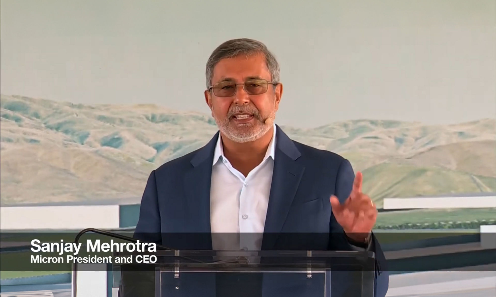 Micron Chairman, President and CEO Sanjay Mehrotra speaking at a podium during Idaho fabrication plant groundbreaking ceremony