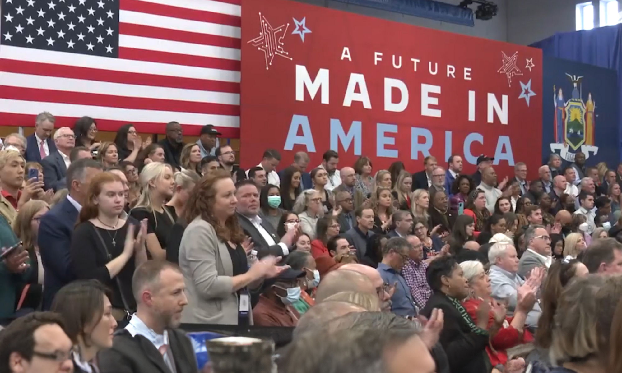 A crowd sitting in front of flags at Micron's Workforce of the Future event.